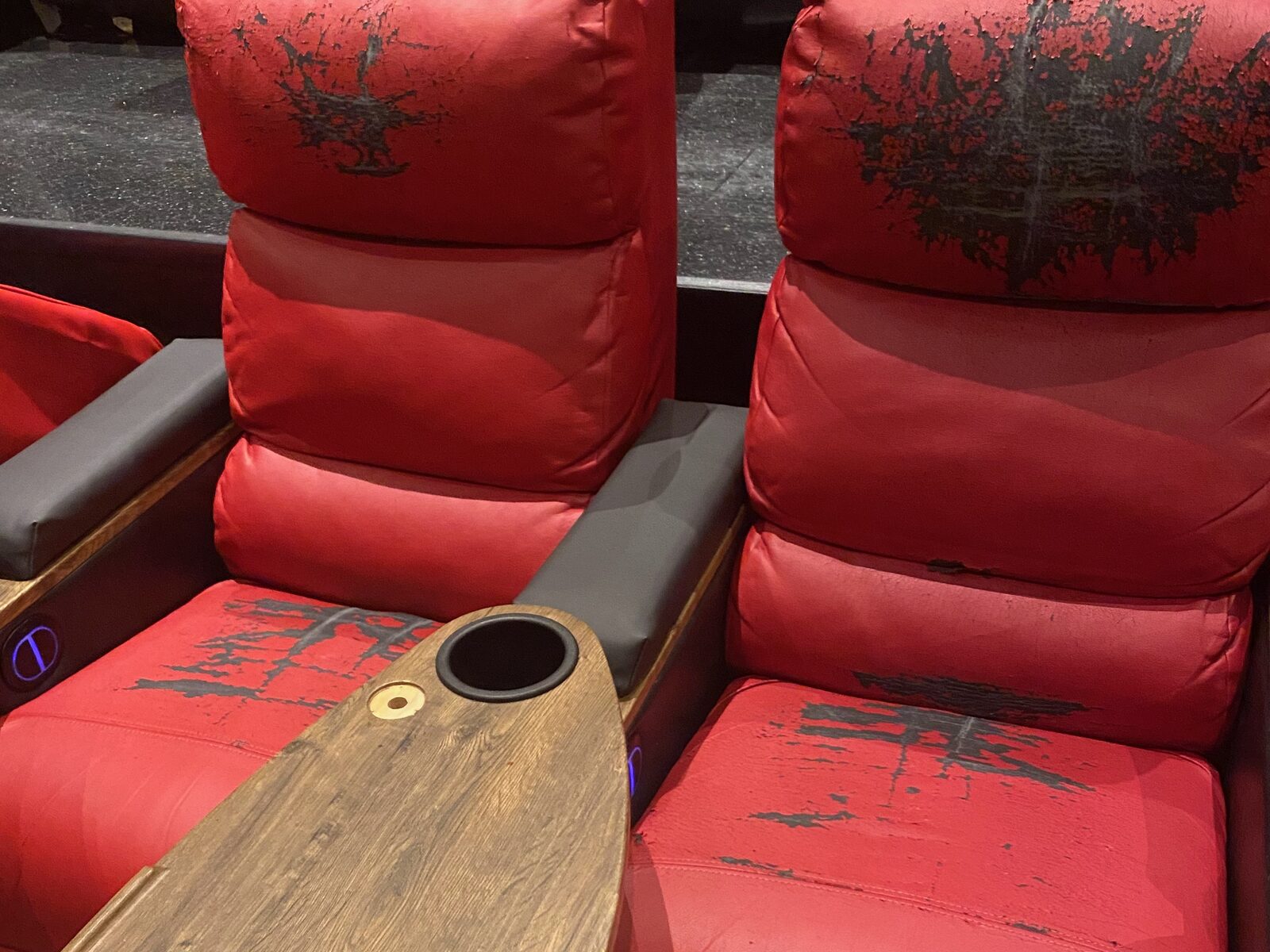 Worn movie theater seats before recovering